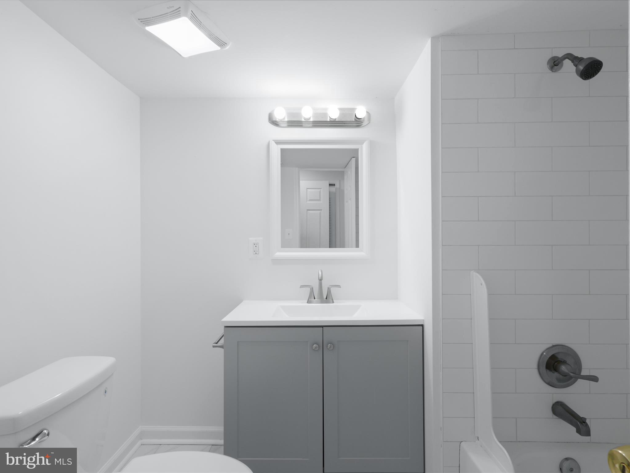 2369 Old Trail Drive Reston, VA 20191 - Photo 37 of 50 a bathroom with a sink toilet and mirror