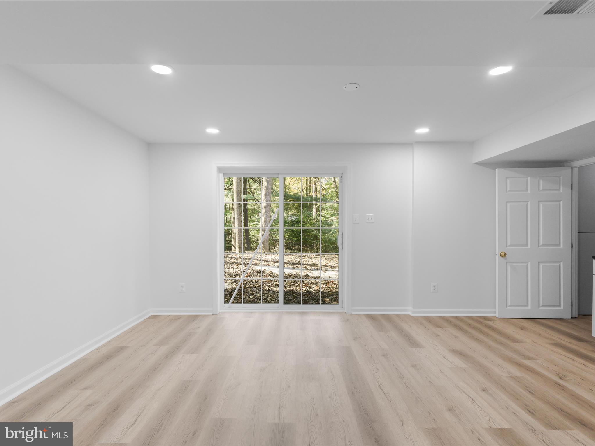 2369 Old Trail Drive Reston, VA 20191 - Photo 38 of 50 a view of an empty room with wooden floor and a window