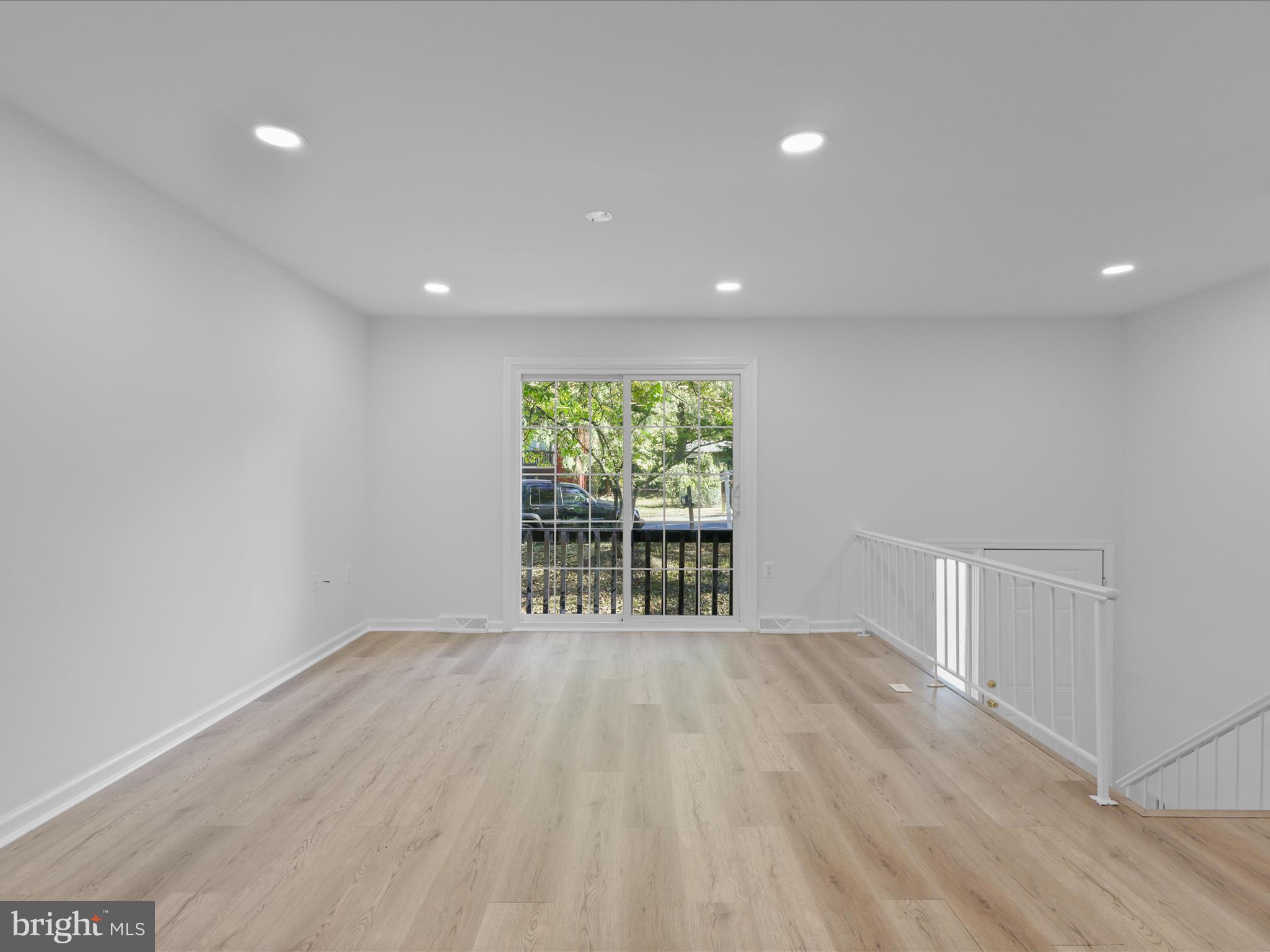 2369 Old Trail Drive Reston, VA 20191 - Photo 9 of 50 wooden floor in an empty room with a window