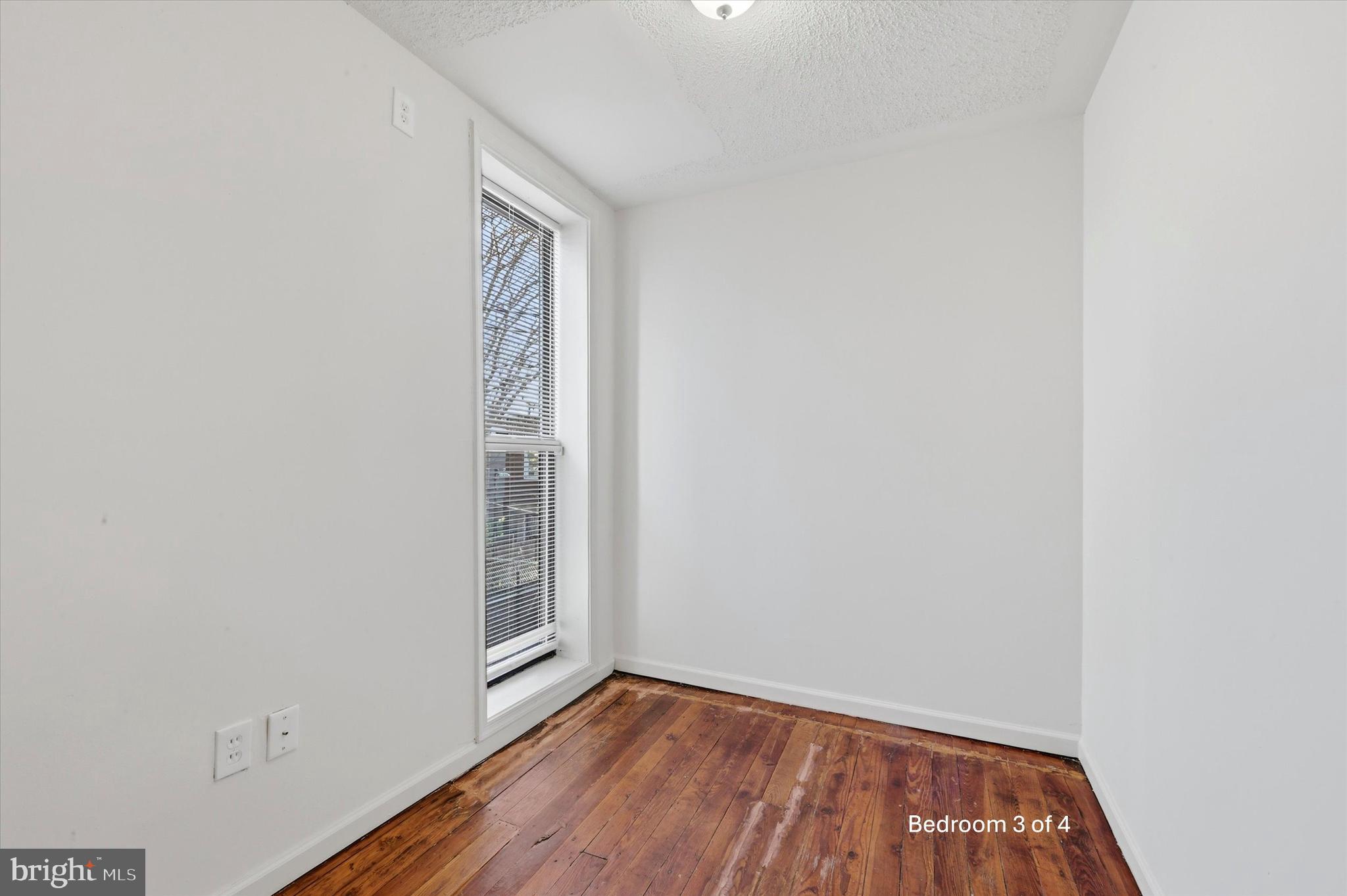 1925 South 21st Street Philadelphia, PA 19145 - Photo 11 of 15 a view of an empty room with wooden floor and a window