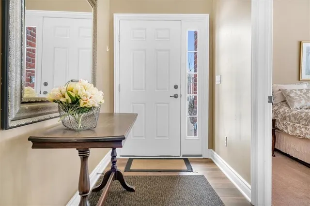 a view of dining room with furniture and wooden floor