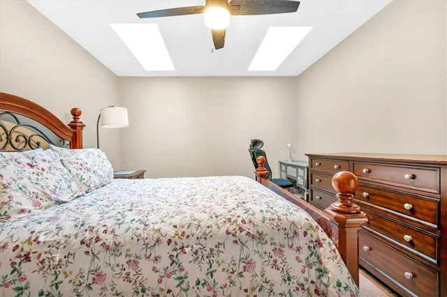 a bedroom with a bed and cabinets