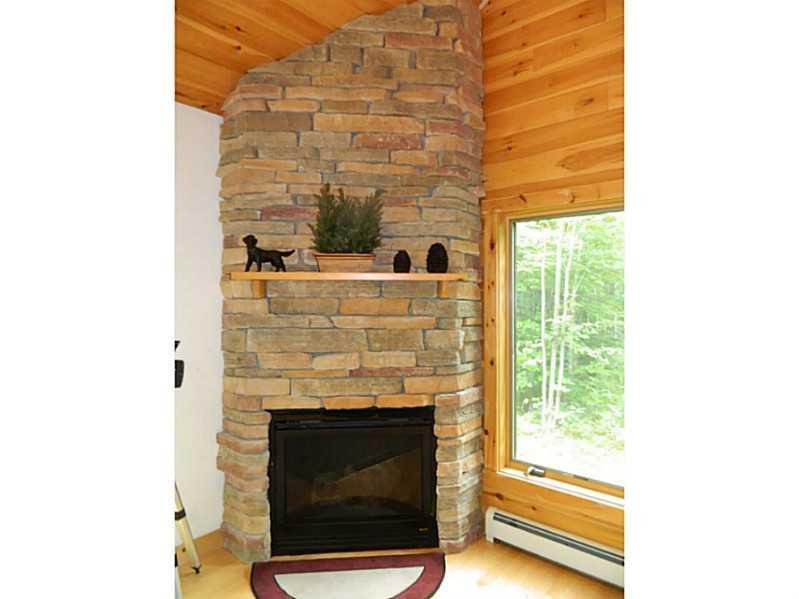 19 Mountain View Road Newry, ME 04261 - Photo 10 of 32 Striking floor to ceiling gas fireplace.