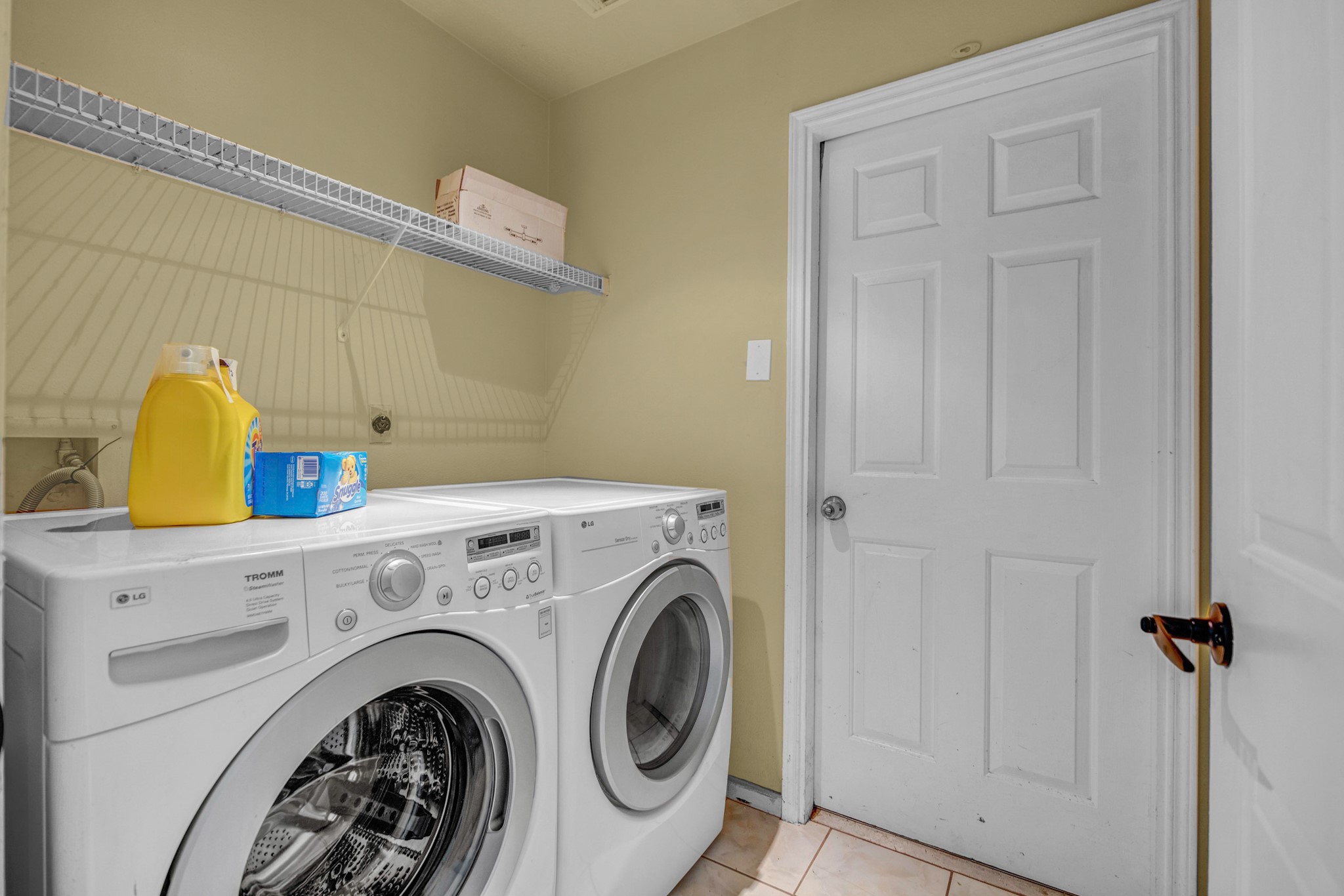 8222 Viny Ridge Drive Houston, TX 77083 - Photo 13 of 34 a utility room with dryer and washer