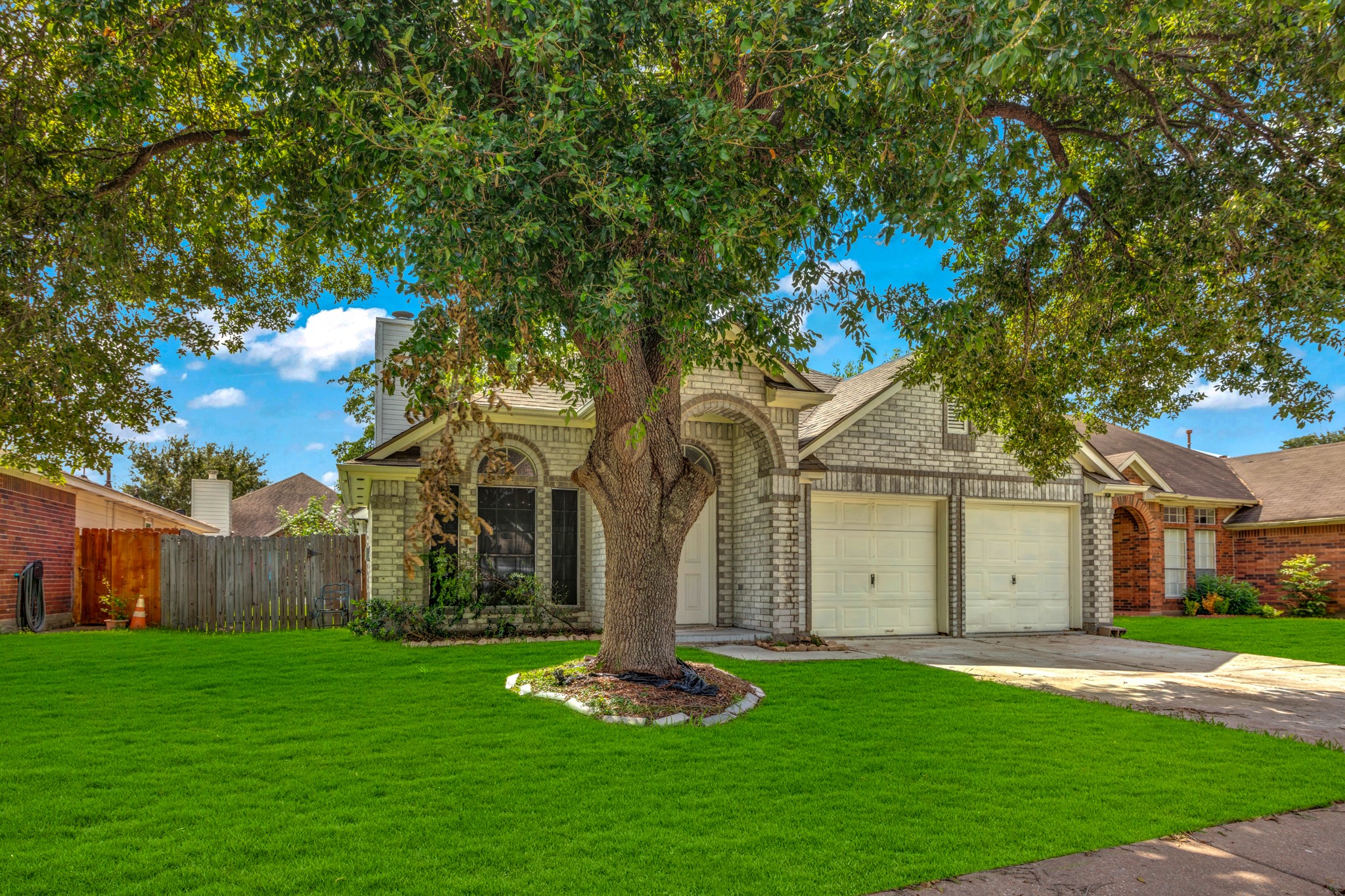 8222 Viny Ridge Drive Houston, TX 77083 - Photo 33 of 34 a front view of a house with garden
