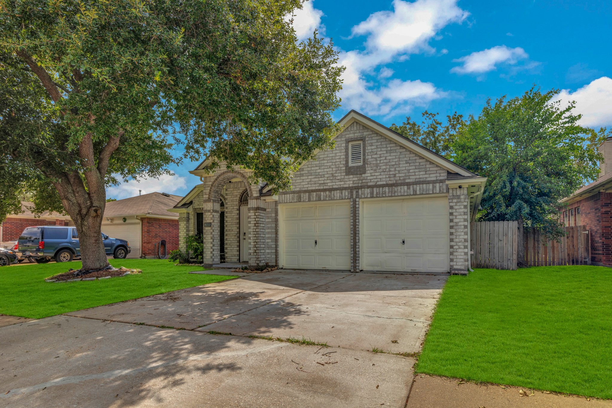 8222 Viny Ridge Drive Houston, TX 77083 - Photo 34 of 34 a view of a house with a yard and large tree