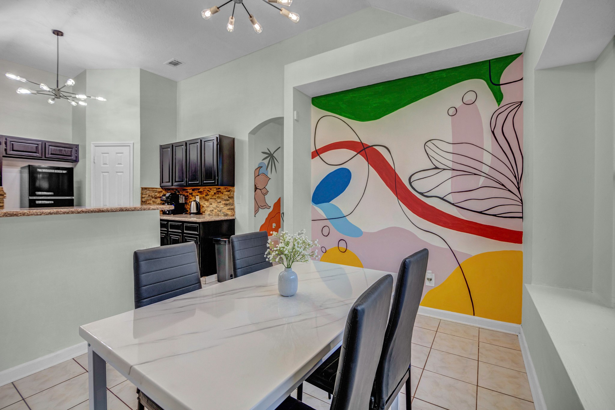 8222 Viny Ridge Drive Houston, TX 77083 - Photo 6 of 34 a kitchen with a table and chairs in it