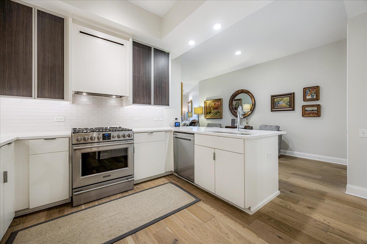 717 Riverside Drive, Unit 207 Memphis, TN 38103 - Photo 13 of 30 a kitchen with a stove oven and sink