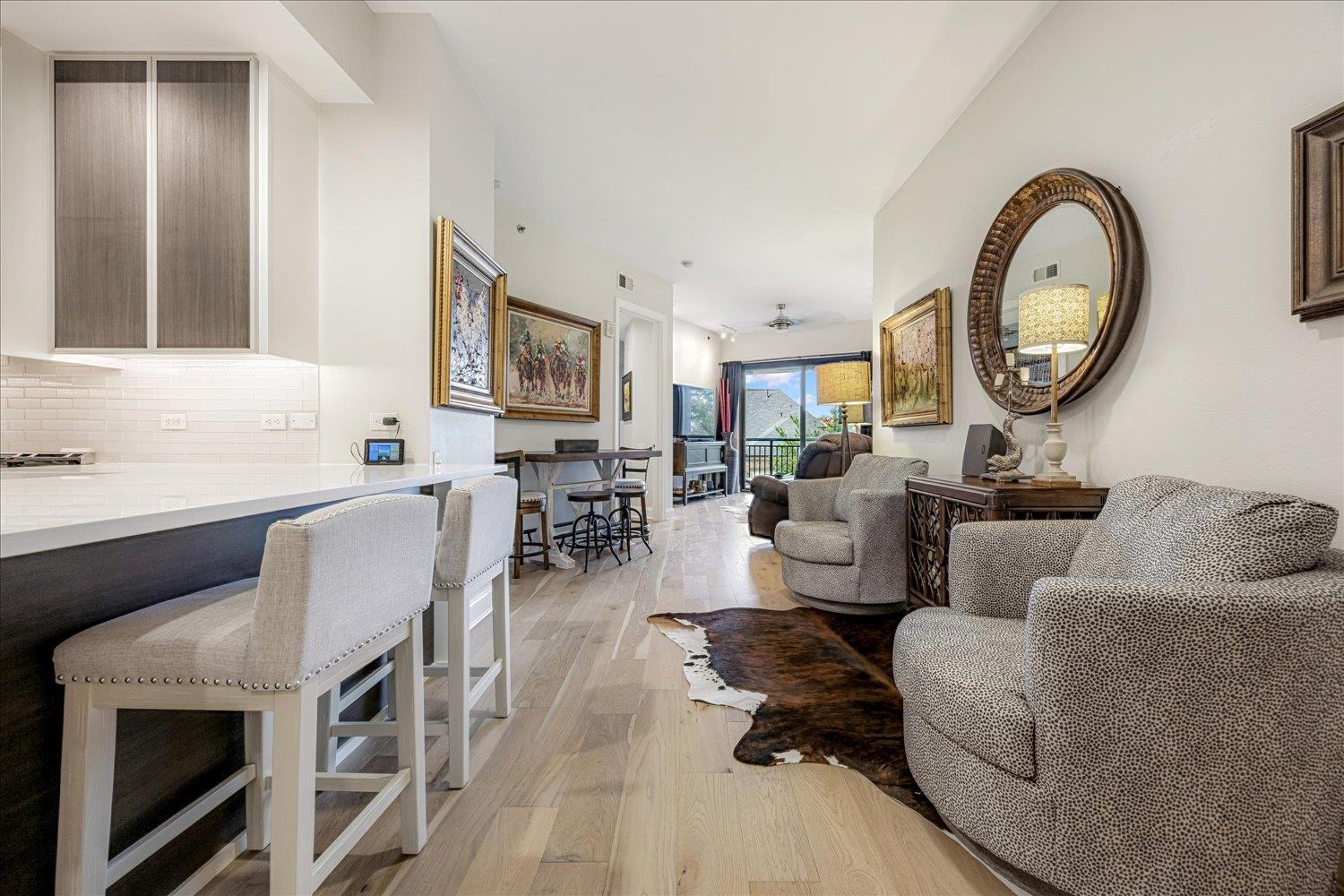 717 Riverside Drive, Unit 207 Memphis, TN 38103 - Photo 14 of 30 a living room with furniture a large window and a mirror