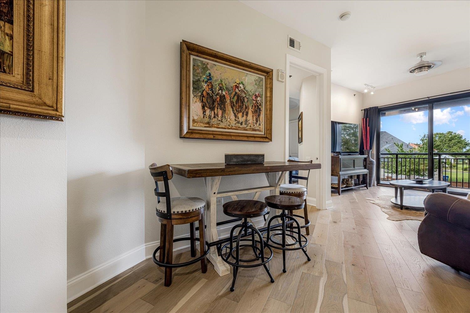 717 Riverside Drive, Unit 207 Memphis, TN 38103 - Photo 15 of 30 a view of a dining room with furniture window and wooden floor