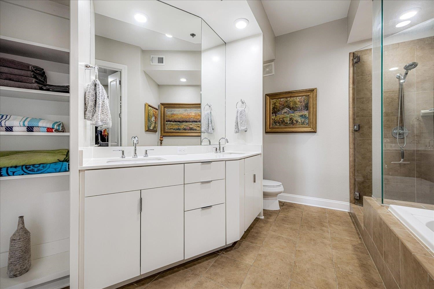 717 Riverside Drive, Unit 207 Memphis, TN 38103 - Photo 24 of 30 a bathroom with a double vanity sink mirror and toilet