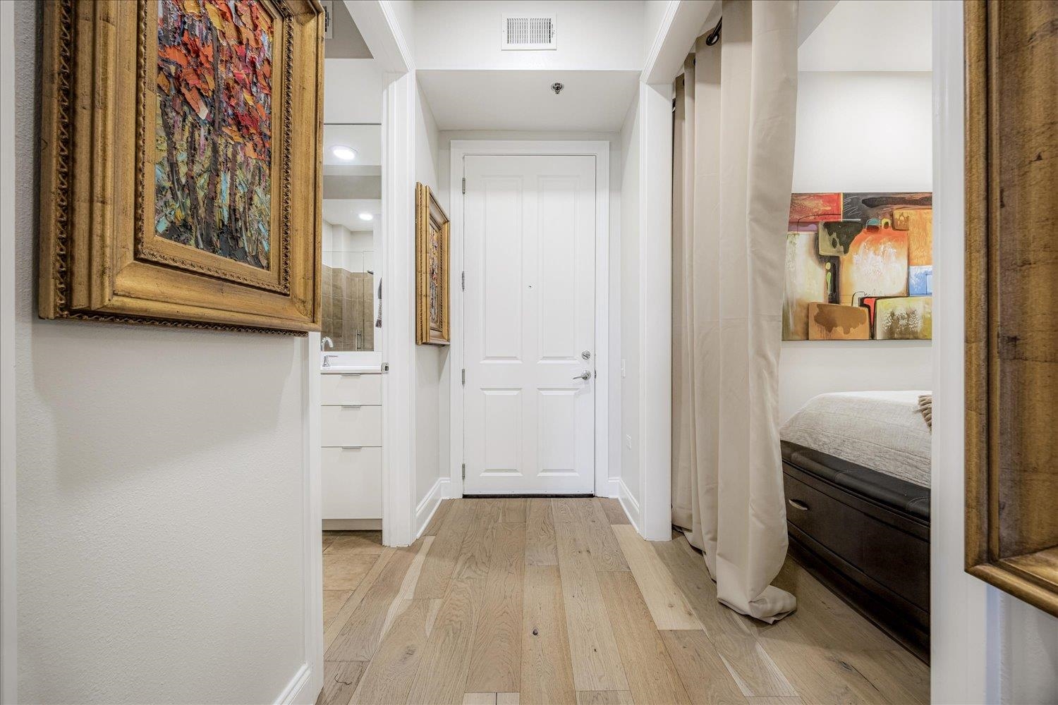 717 Riverside Drive, Unit 207 Memphis, TN 38103 - Photo 3 of 30 a view of a hallway with wooden floor and closet