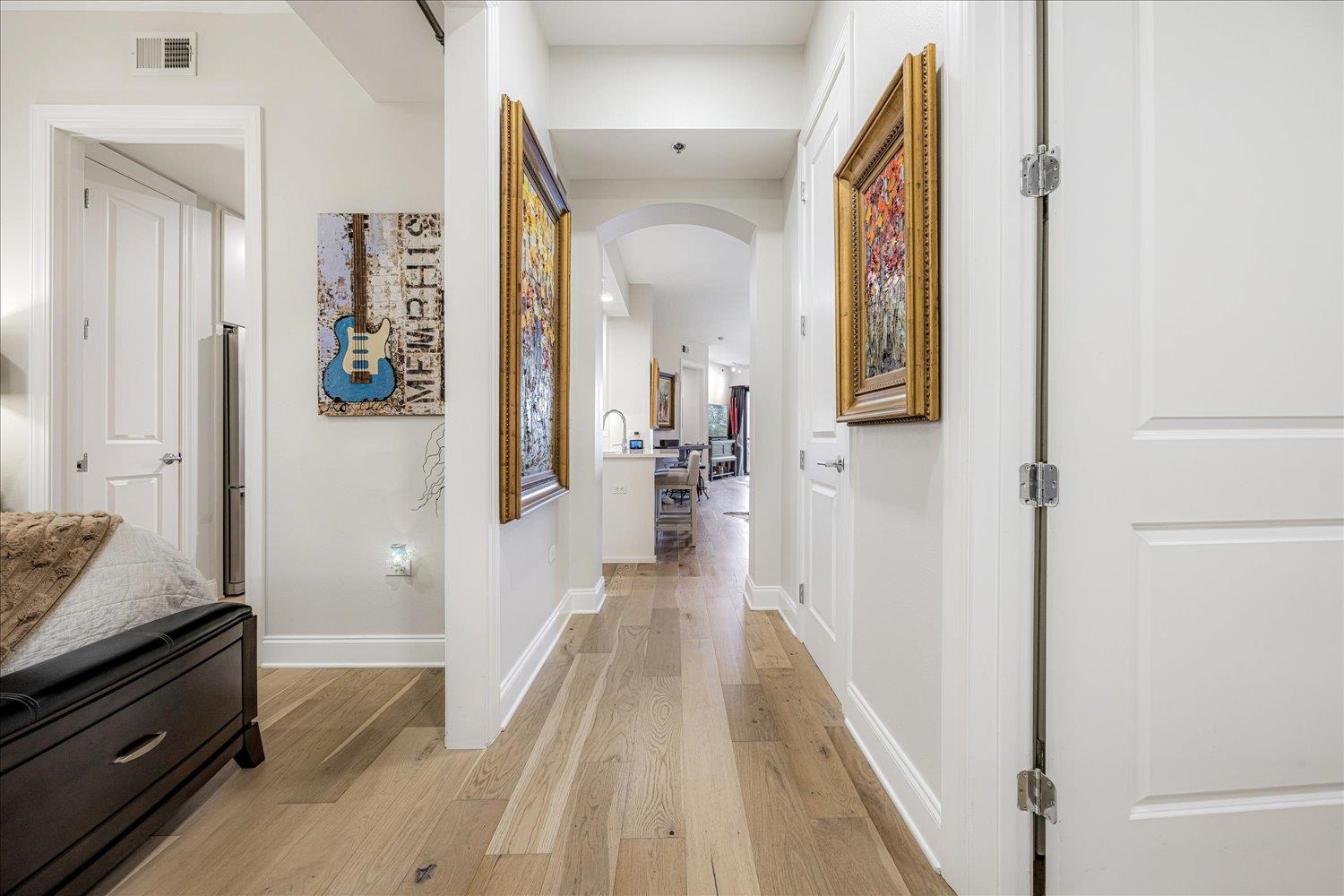 717 Riverside Drive, Unit 207 Memphis, TN 38103 - Photo 8 of 30 a view of a hallway view with wooden floor and staircase