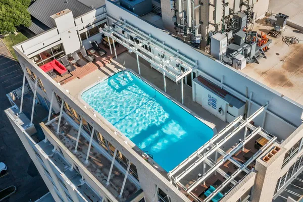 a view of a swimming pool with a deck