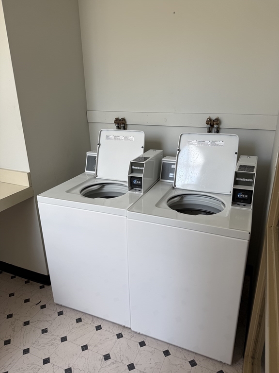 100 Captains Row, Unit 203 Chelsea, MA 02150 - Photo 13 of 16 a utility room with dryer and washer