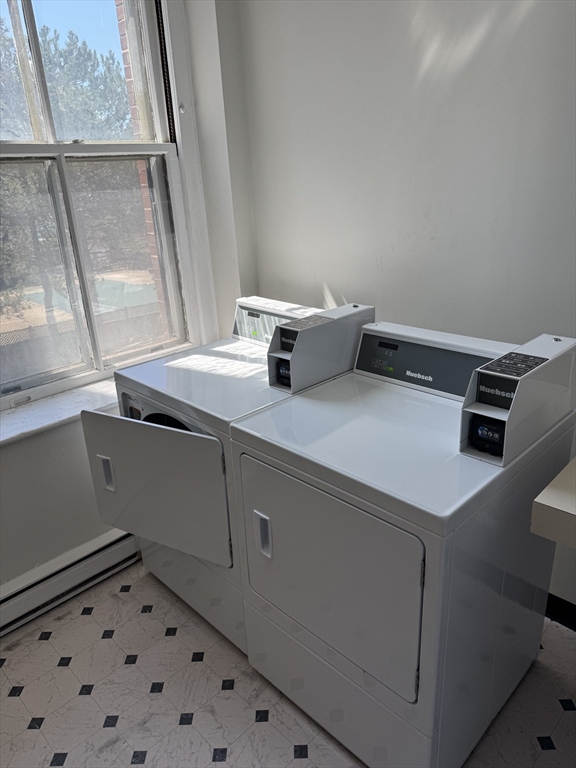 100 Captains Row, Unit 203 Chelsea, MA 02150 - Photo 14 of 16 a utility room with dryer and washer