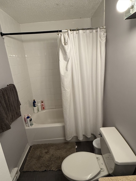 100 Captains Row, Unit 203 Chelsea, MA 02150 - Photo 3 of 16 a bathroom with a sink toilet and shower