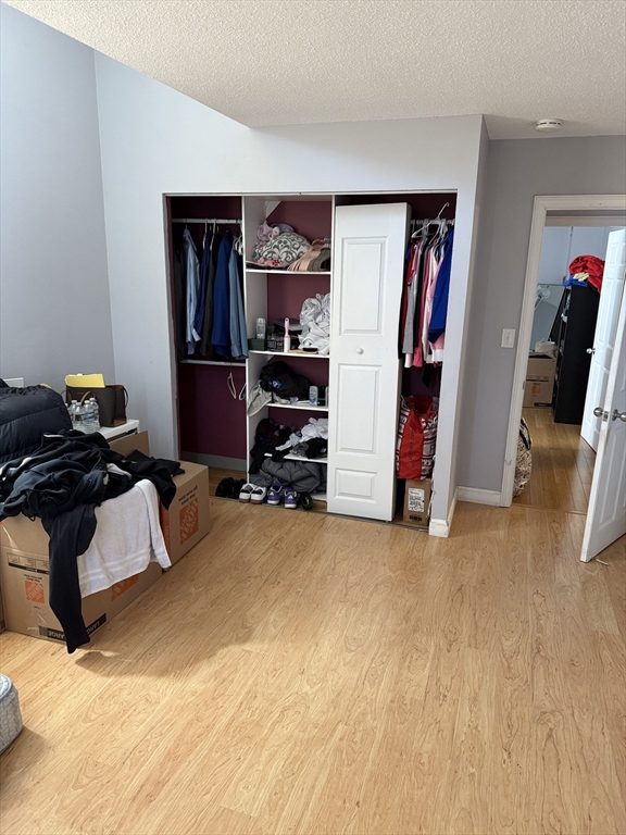 100 Captains Row, Unit 203 Chelsea, MA 02150 - Photo 10 of 16 a view of a livingroom with furniture and closet
