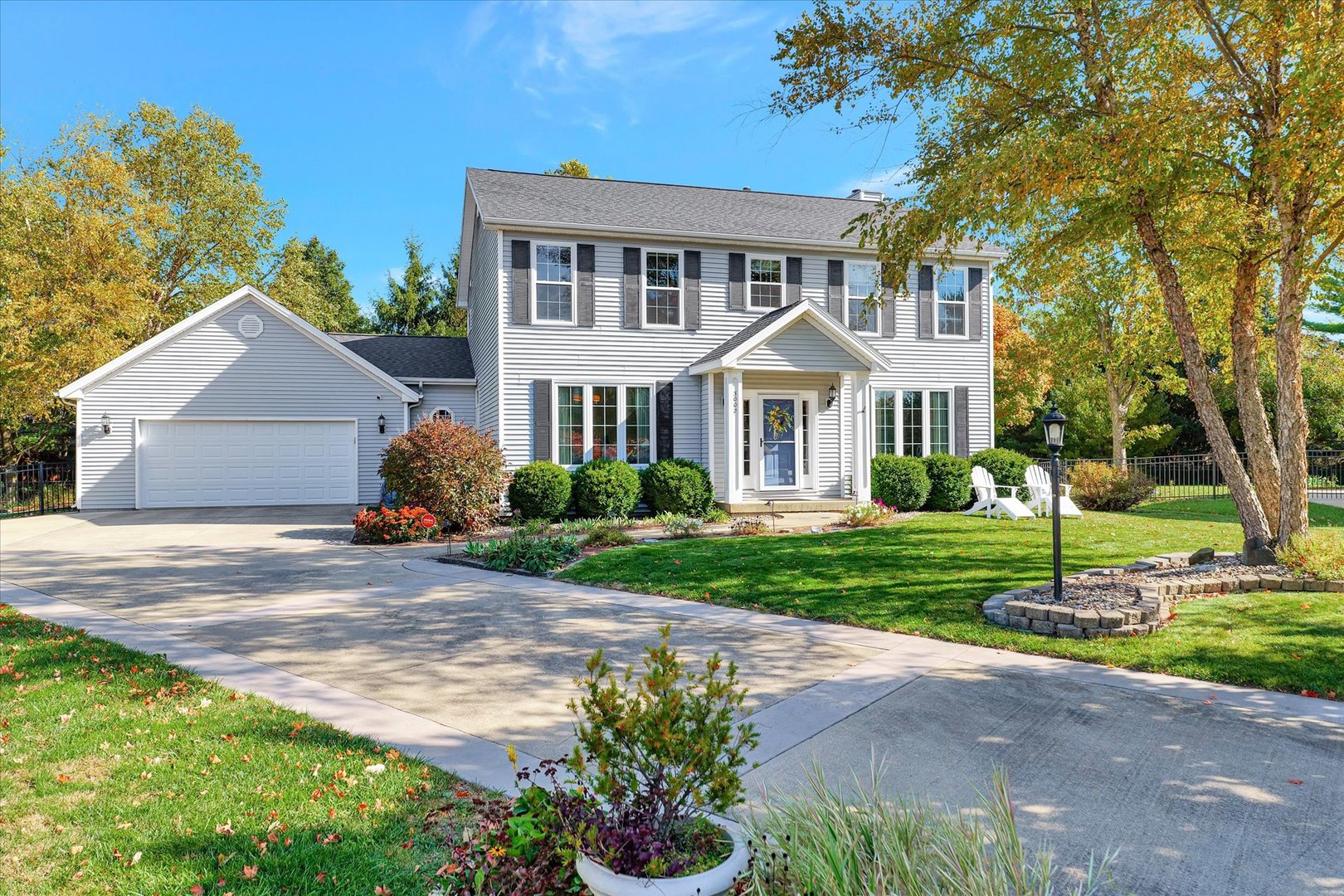 3002 Country Bend Lane Champaign, IL 61822 - Photo 1 of 48 a front view of a house with a garden and trees