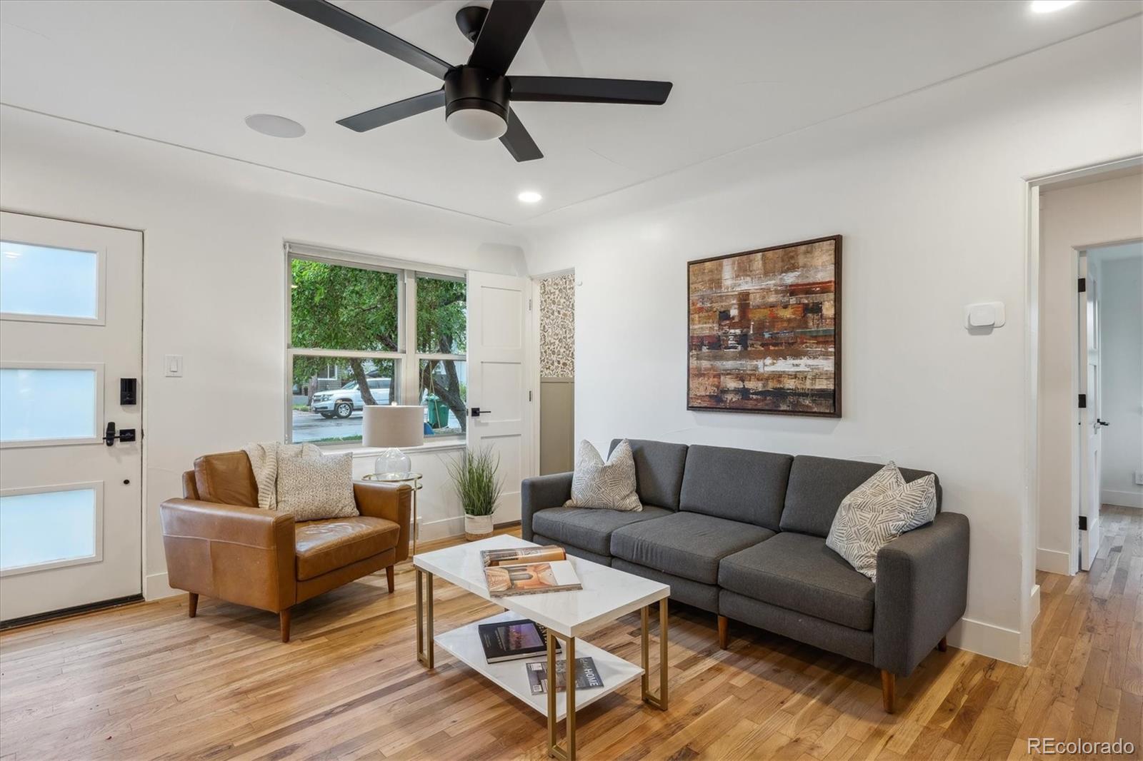 3200 Ames Street Wheat Ridge, CO 80212 - Photo 11 of 46 a living room with furniture and a large window