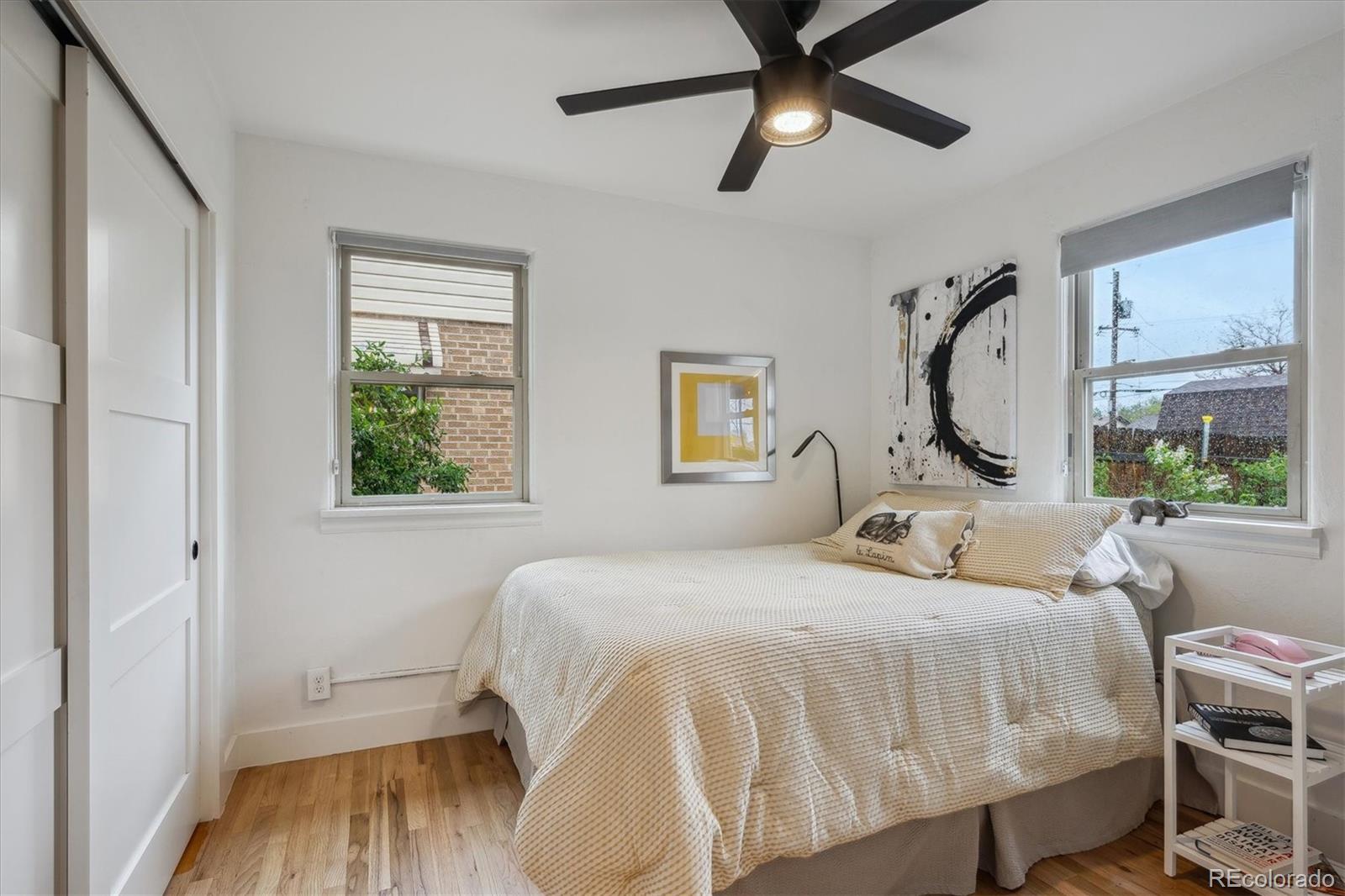 3200 Ames Street Wheat Ridge, CO 80212 - Photo 26 of 46 a bedroom with a bed and a large window