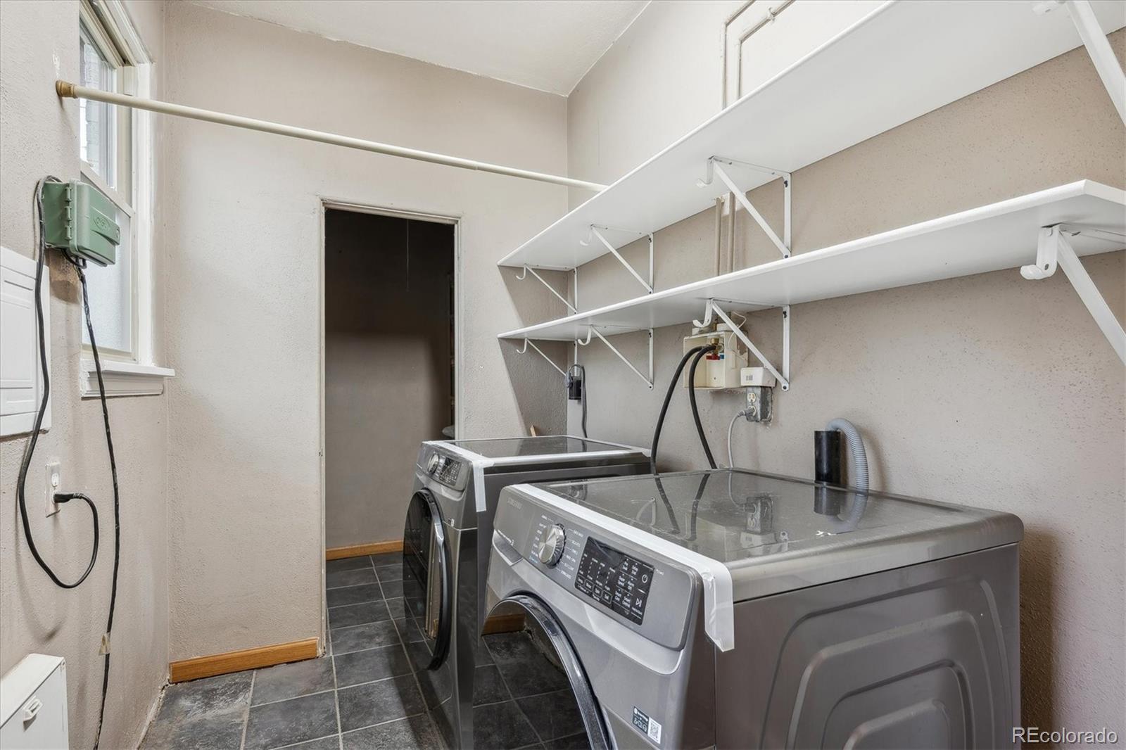 3200 Ames Street Wheat Ridge, CO 80212 - Photo 31 of 46 a utility room with dryer and washer