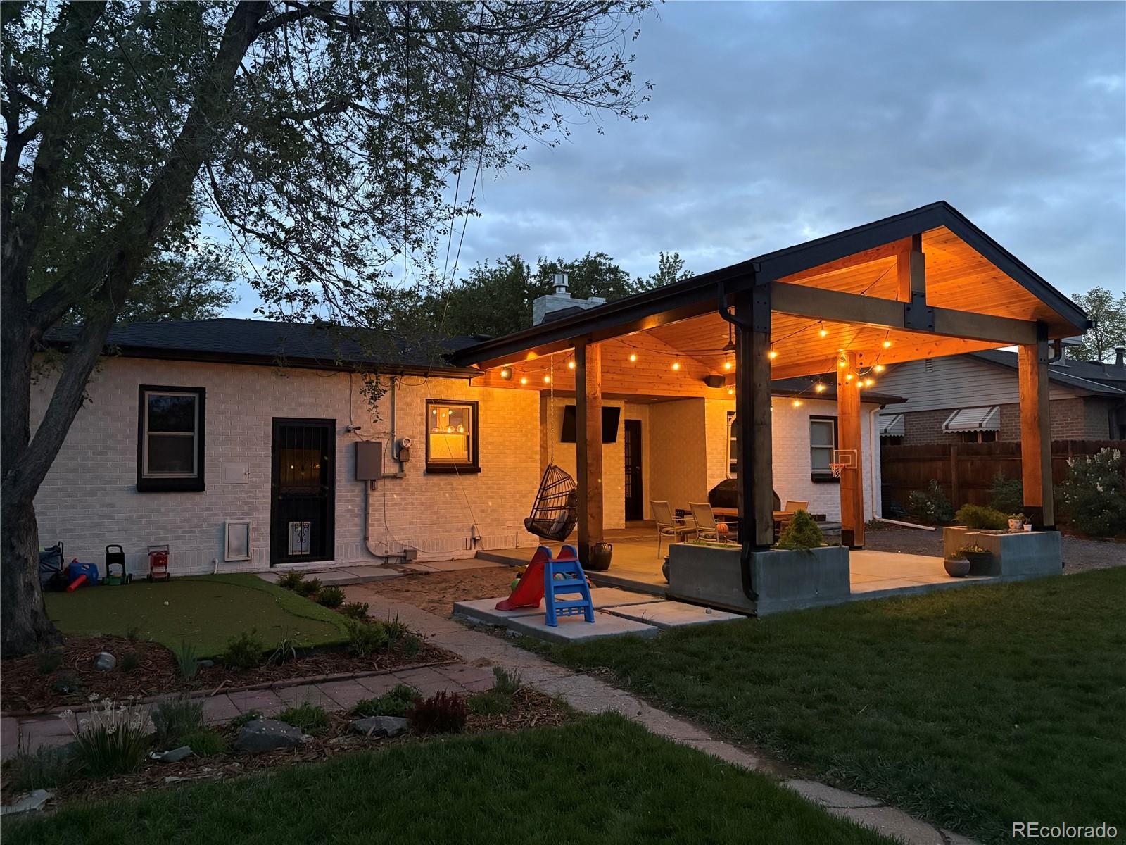 3200 Ames Street Wheat Ridge, CO 80212 - Photo 33 of 46 a view of a house with backyard and porch