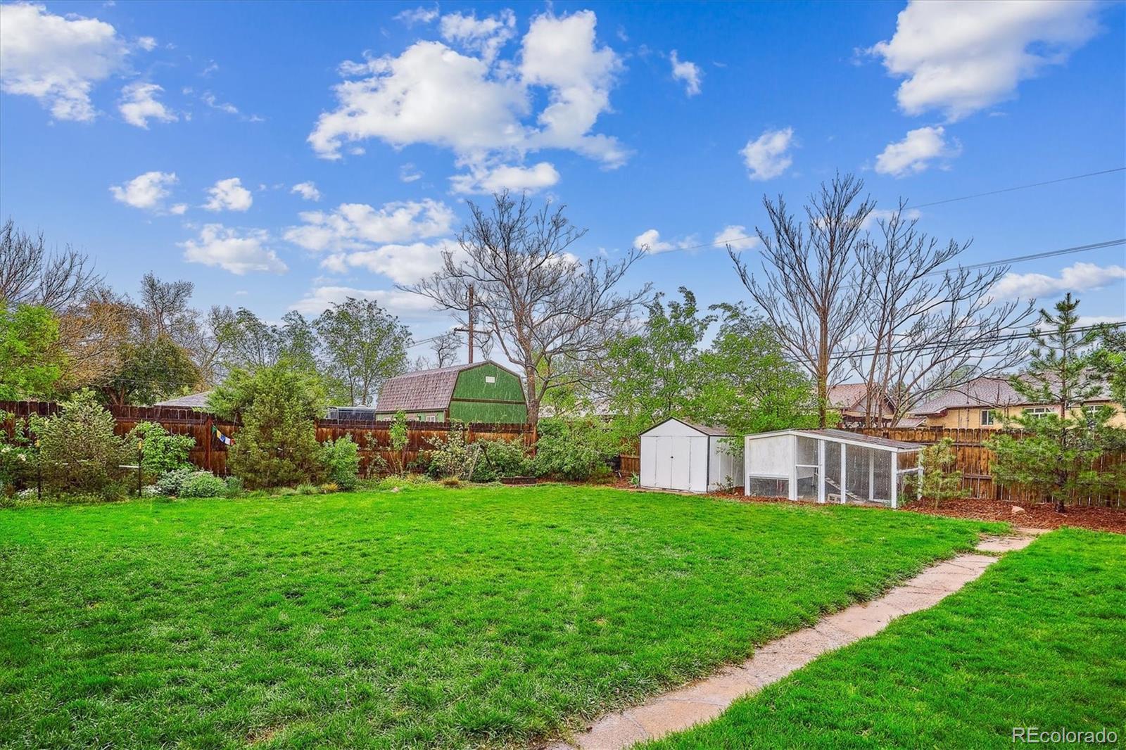 3200 Ames Street Wheat Ridge, CO 80212 - Photo 37 of 46 a view of a house with a big yard