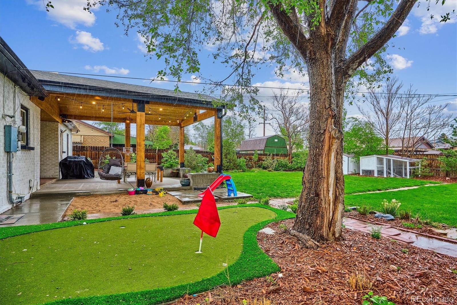 3200 Ames Street Wheat Ridge, CO 80212 - Photo 38 of 46 a view of a backyard with a patio