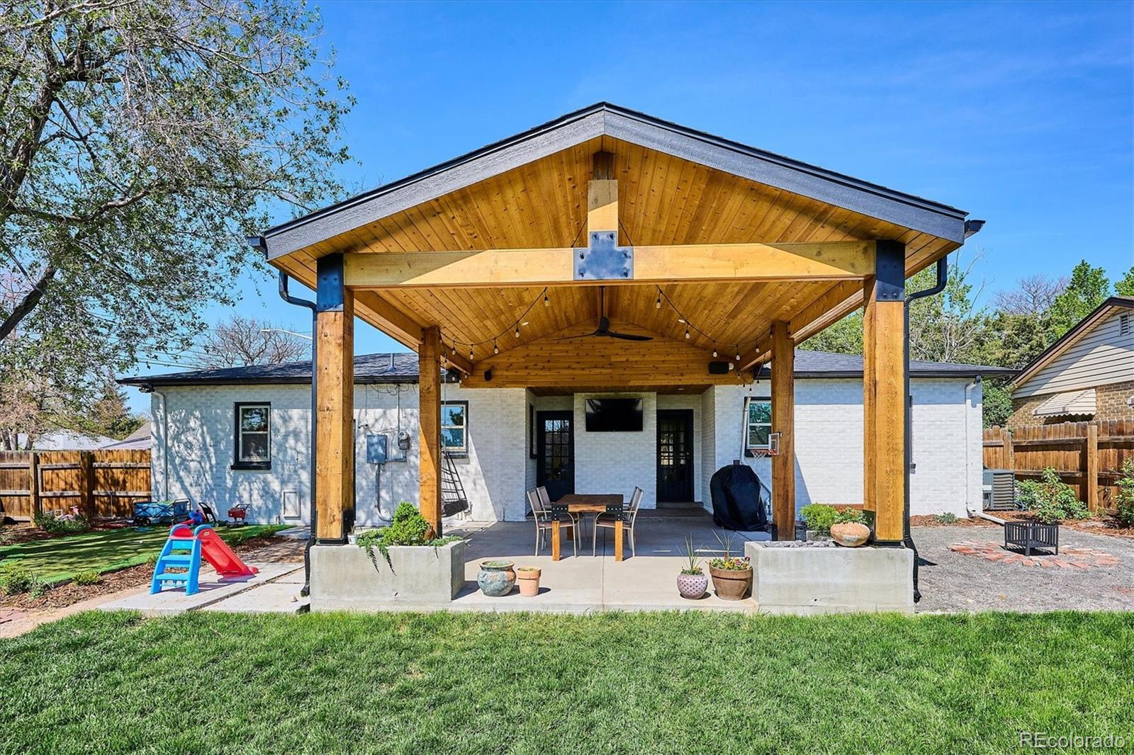 3200 Ames Street Wheat Ridge, CO 80212 - Photo 41 of 46 a view of a house with backyard and porch