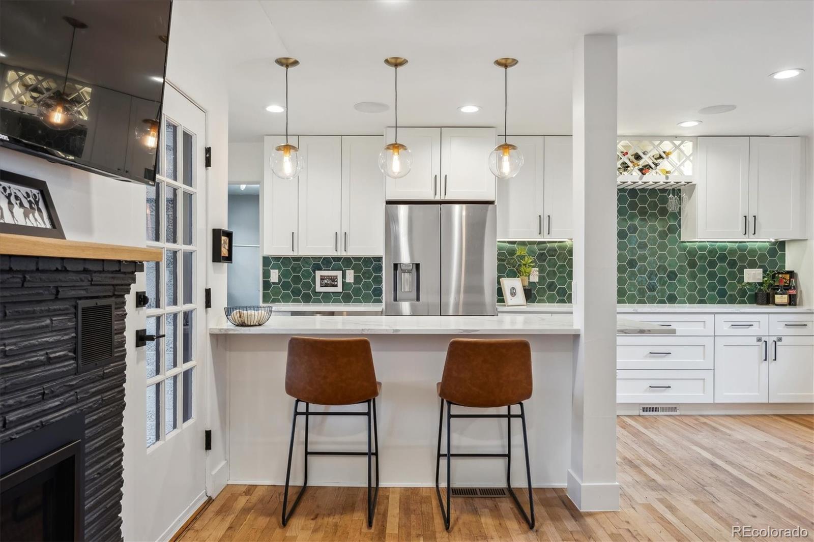 3200 Ames Street Wheat Ridge, CO 80212 - Photo 8 of 46 a kitchen with appliances a sink and cabinets