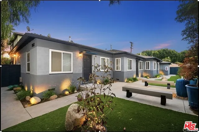 a front view of a house with garden