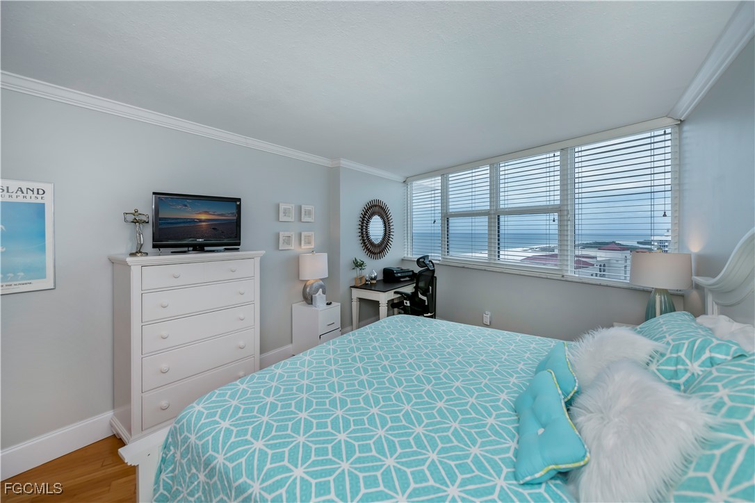 58 North Collier Boulevard, Unit 2010 Marco Island, FL 34145 - Photo 17 of 48 a bed room with a bed and a television