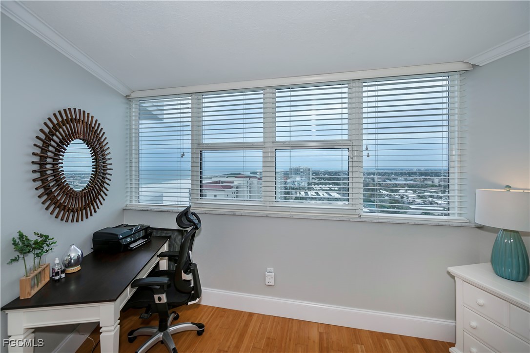 58 North Collier Boulevard, Unit 2010 Marco Island, FL 34145 - Photo 18 of 48 a view of a workspace with furniture and a window