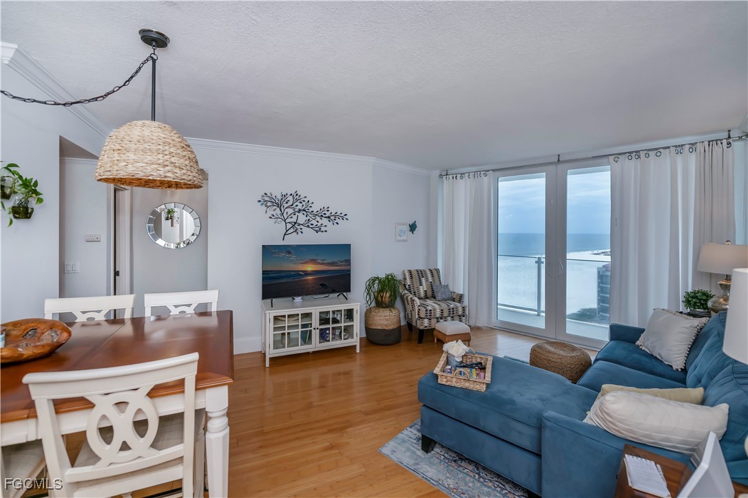 58 North Collier Boulevard, Unit 2010 Marco Island, FL 34145 - Photo 6 of 48 a living room with furniture and a flat screen tv