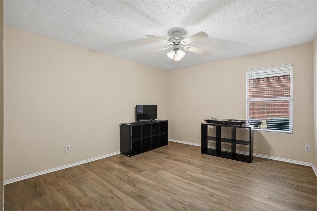 8704 Serenity Way Denton, TX 76210 - Photo 14 of 29 a view of workspace with wooden floor