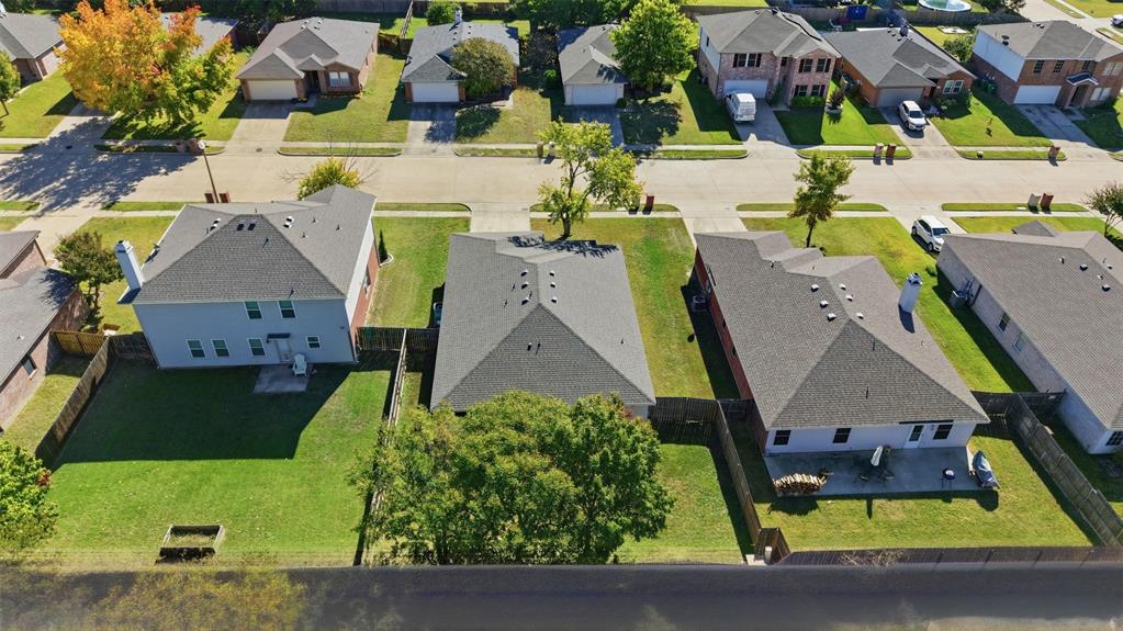 8704 Serenity Way Denton, TX 76210 - Photo 26 of 29 an aerial view of residential houses with outdoor space