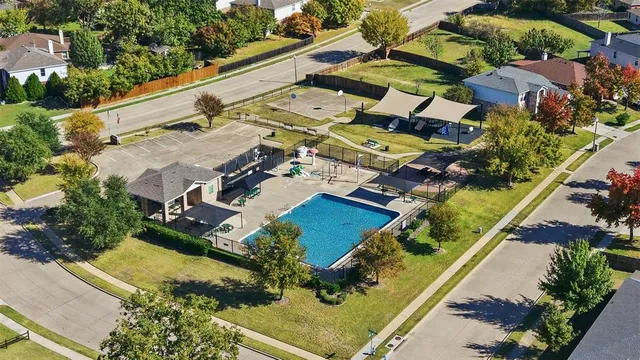 an aerial view of residential houses with outdoor space