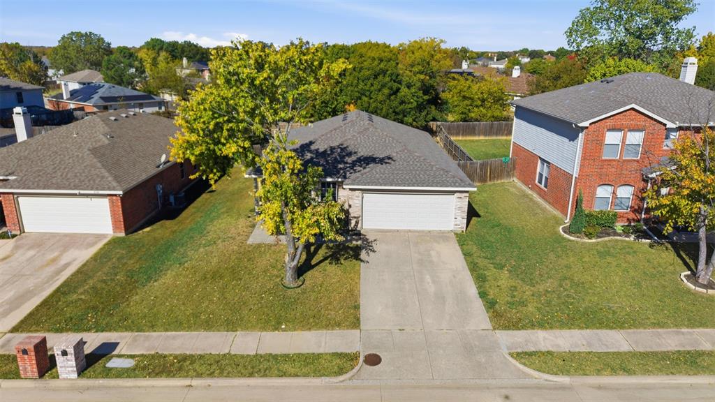 8704 Serenity Way Denton, TX 76210 - Photo 5 of 29 a aerial view of a house with a yard