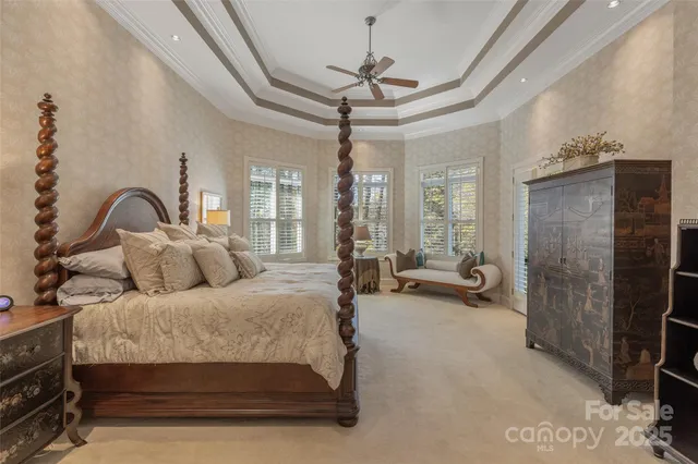 a spacious bedroom with a bed and a table