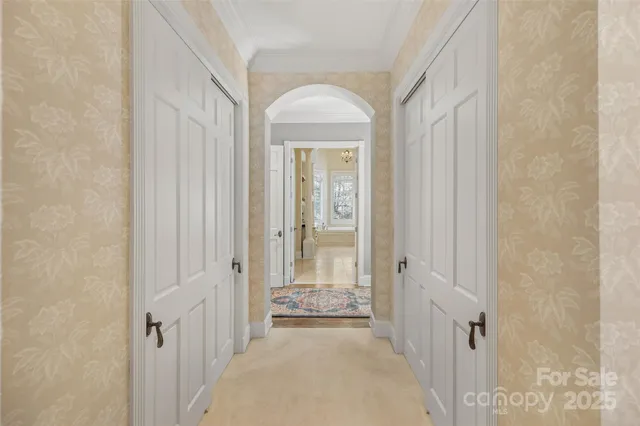 a spacious bathroom with double sink and a mirror