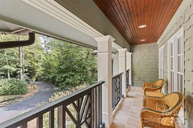 a en suite bathroom with a granite countertop sink and a mirror