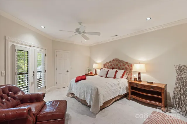 a bedroom with furniture and wooden floor