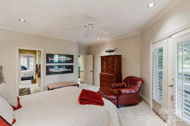 a aerial view of a house next to a yard with large trees