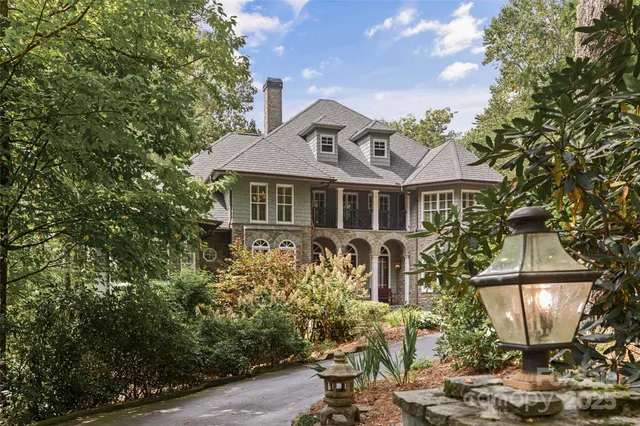 a view of a lush green hillside and a houses