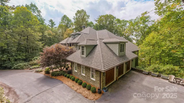 a view of a lush green hillside and a houses