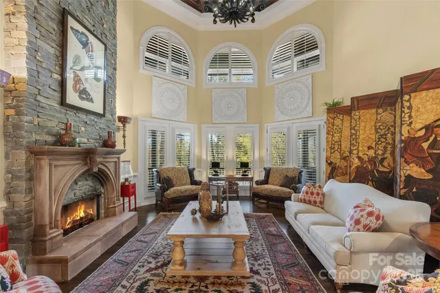 a living room with fireplace furniture and a fireplace