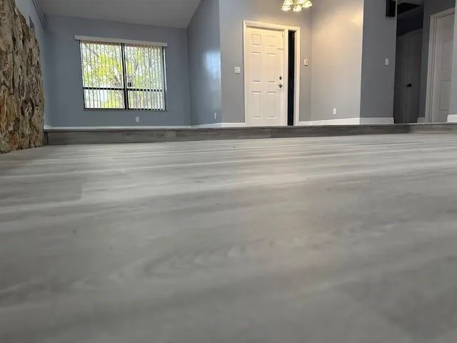 a view of an empty room with a window