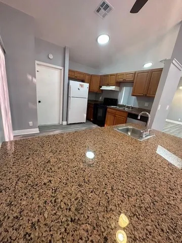 an empty room with wooden floor