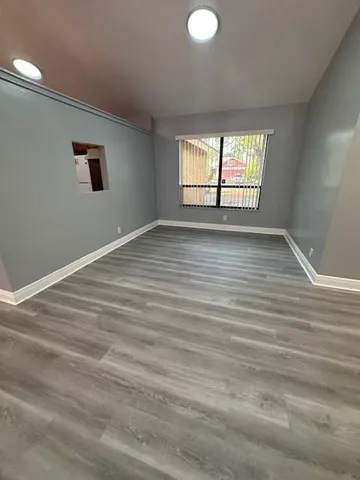 a view of an empty room with a window